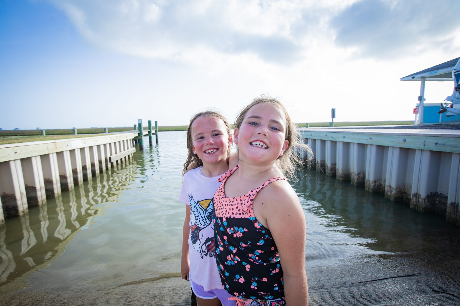 girls smiling on the docks